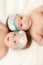 Two twin babies, girls in nice headbands