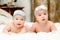 Two twin babies, girls in nice headbands