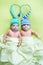 Two twins brothers babies weared in hats