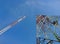 Two type of Telecommunication towers antenna on blue sky background