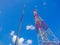 Two type of Telecommunication towers antenna on blue sky background