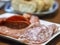 Two types of sliced salami on a serving plate as catering concept