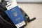 Two ukrainian biometrical passports with air flight tickets on black touristic backpack