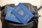 Two ukrainian biometrical passports on black touristic backpack