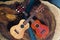 Two ukuleles in different colors - light and dark brown on beautiful wooden table