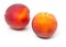 Two uncut, whole, ripe peaches fruit