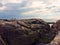 two undefined people walking on a rock by the sea in Sweden