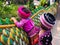 Two unidentified Akha children photographed behind at Wat Phratat Doi Suthep in Chiang Mai, Thailand.