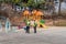 Two unidentified city workers inspect playground equipment at urban park