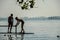 Two unidentified unknown poor slum boys, wearing shorts, playing near Versova beach, Mumbai, Maharashtra, India