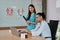 Two uniformed young doctors work in medical clinic office