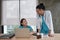 Two uniformed young doctors work in medical clinic office