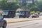Two UPS trucks travel down an Atlanta street