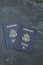 Two US passports on black background