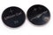Two used lithium button batteries on white background close-up