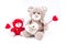 Two valentine bears holding hearts
