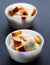 Two vanilla ice-cream with peach. Selective focus