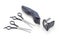 Two various hairdressers scissors and electric hair clipper