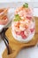 Two verrines for appetizer. Shrimps with grapefruit and cream