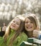 Two very happy grils in a park