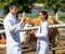Two veterinarians preparing medicine in syringe treating cow