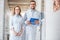 two veterinarians in white coats standing in veterinary clinic and looking