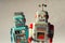 Two vintage tin toy robots, robotic delivery, artificial intelligence concept