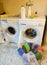Two washing machines and clothes to wash and interior of a laund