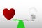 Two way arrows with heart and light bulb - Concept of choosing heart over mind