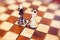 two wedding rings on chessboard