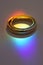 Two wedding rings with rainbow light