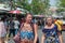 Two westerner mature ladies seem to be friend walking and talking together in Chatuchak weekend market