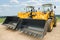 Two wheel loaders excavators