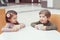 Two white Caucasian cute adorable funny children toddlers sitting together