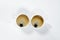 Two white cups of coffee with froth. On white background. Breakfast.