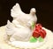 Two white doves on wedding cake bride and groom