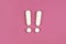 Two white exclamation marks on pink background. Flat lay, warning sign, keep attention, alert concept