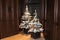 Two White Flocked Christmas Trees, Orange Ornaments