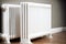 two white heating radiators with underfloor heating