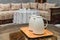 Two white jugs on the wooden table in Moroccan house