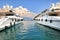 Two white luxury yachts on Mediterranean sea.