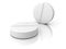 Two white medical pills on white background