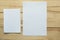 Two white mockup blanks on wooden background.