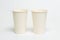 Two white paper large disposable cups for tea or coffee