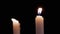 Two White Paraffin Candles are Blown Out by a Stream of Air on Black Background.