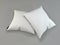 Two white pillows on a gray background.  Mockup square pillows. White sofa cushions. 3d rendering