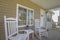 Two white rocking chairs in home entry