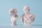 Two white Roman or antique style Grecian busts