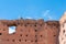 Two white storks on the ruins of the El Badi Palace wall