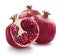 Two whole and one half of pomegranate on white backgrou